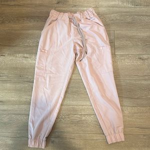 Jaaanuu. Never worn. I am 5’3 and these joggers are perfect height